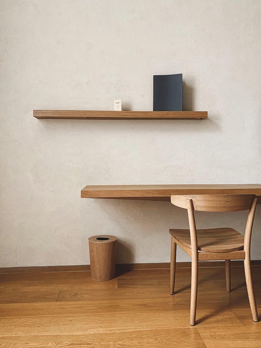Japanese restraint meets Nordic comfort — low forms, natural materials, deliberate space.